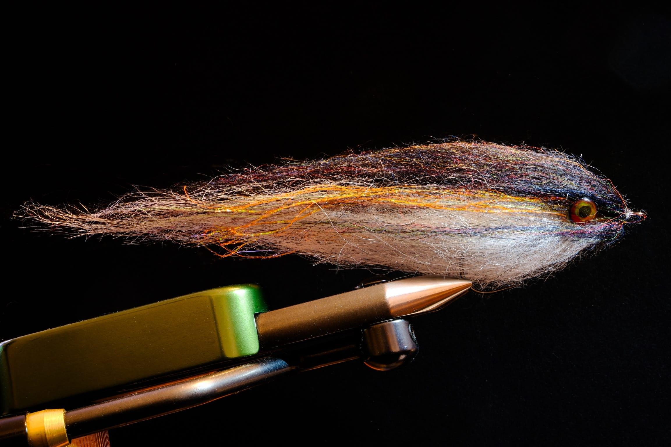 Big hucho streamer dressed by Massimo Ginanneschi using Tommi Fly innovative UV materials and Partridge of Redditch Predaro hook.