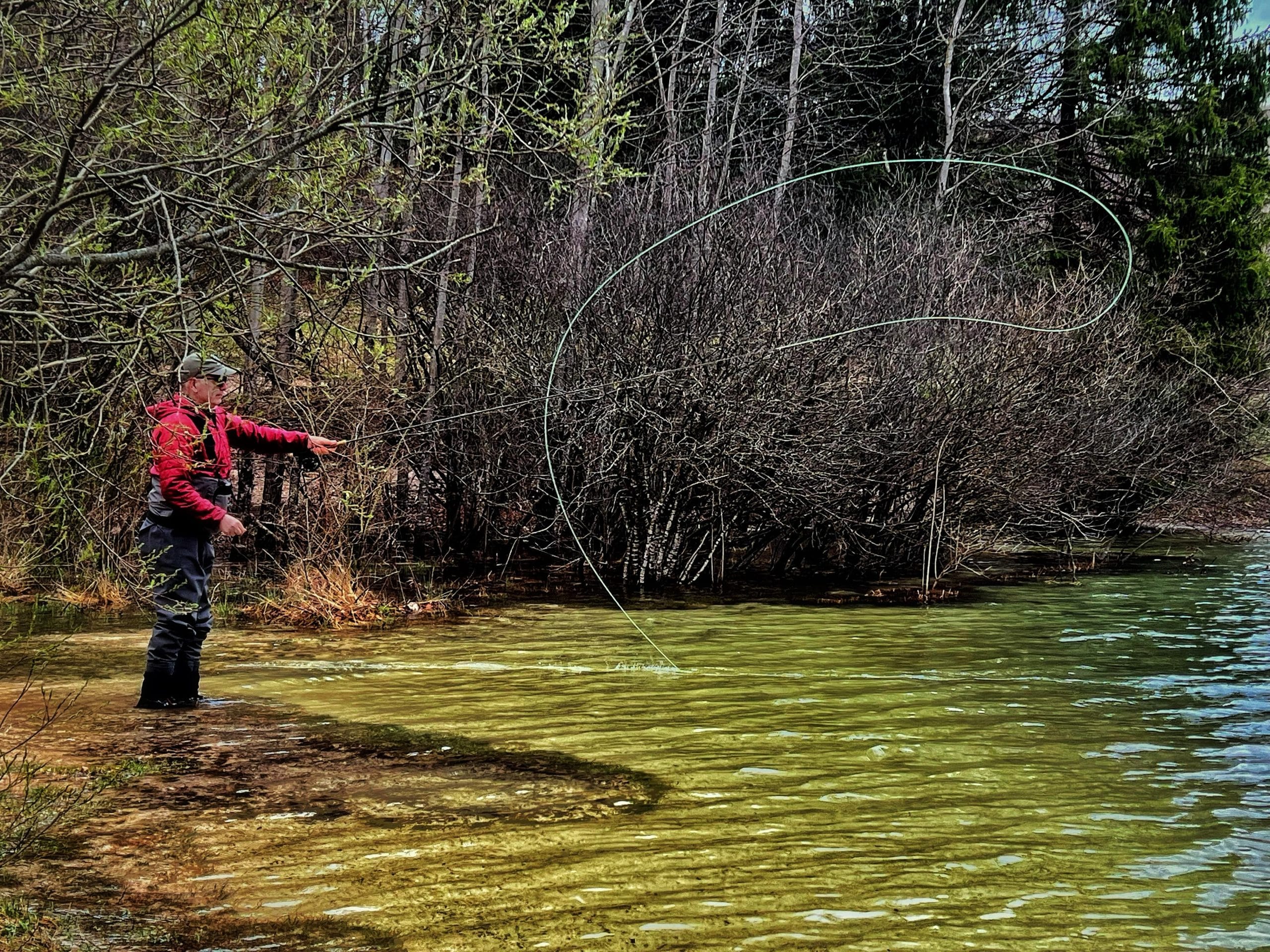 Valerio Santi Amantini performing a Froller cast on lake Bohinj, along Sava Bohinjka, Slovenia.